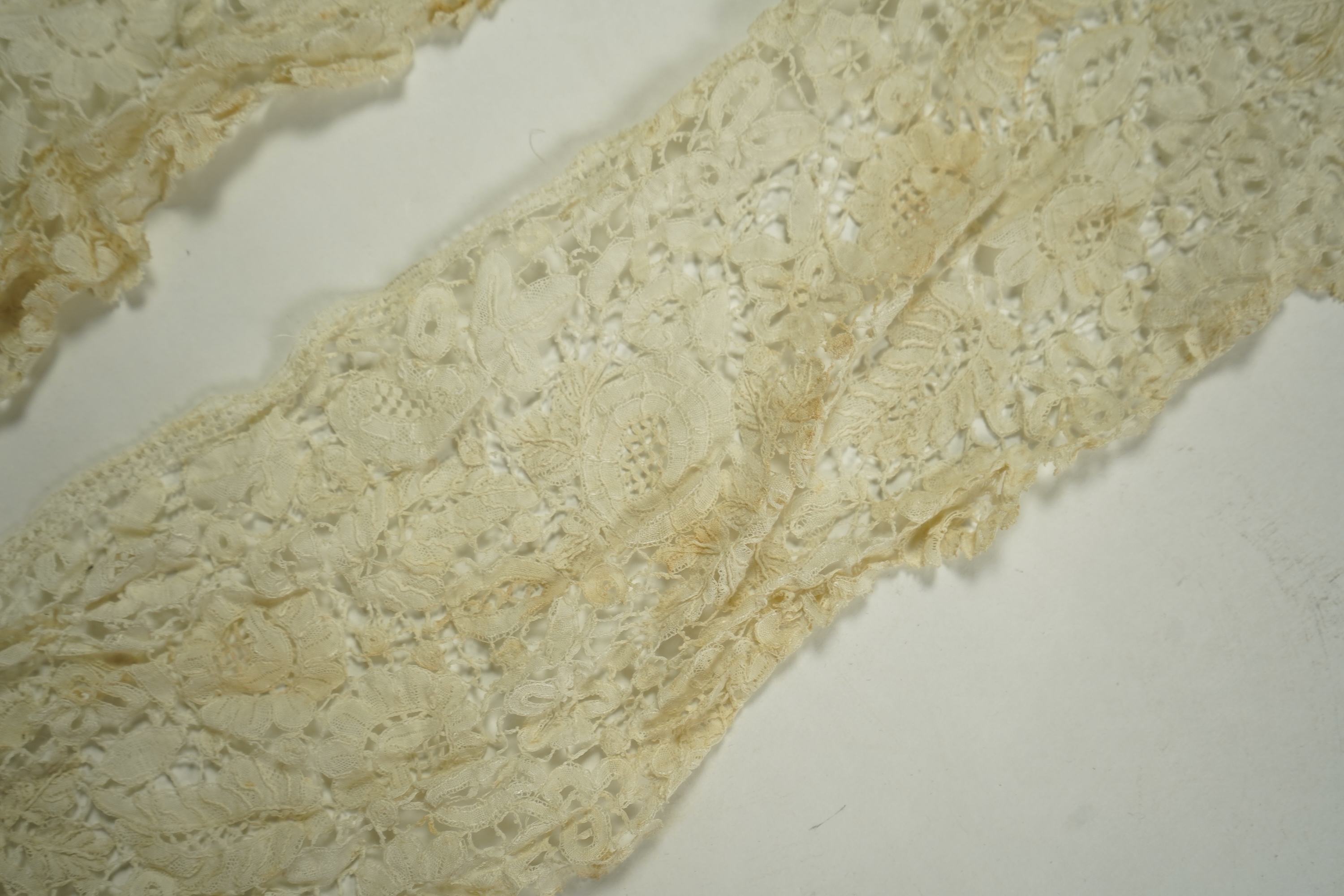 A mixed Brussels bobbin lace and Point de Gaze lace collar, another smaller collar, a similar length of trim and butterfly motif, together with a Brussels bobbin collar and trim, an Irish crochet cuffs, a Valenciennes la